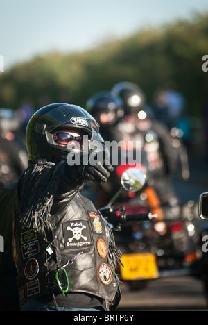 Biker in leathers at biker rally Stock Photo