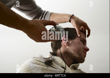 Young man getting his hair cut, Germany, Europe Stock Photo