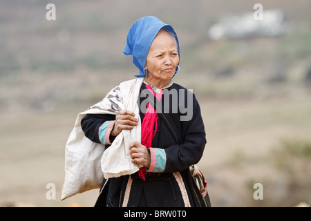 A Black Dzao woman at a market in vietnam Stock Photo