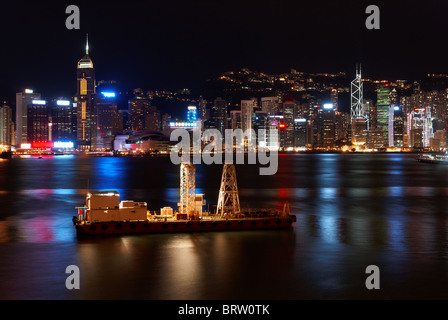 Small freight ship in Hong Kong at night Stock Photo