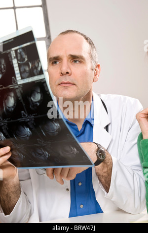 Doctor looking at an x-ray result Stock Photo