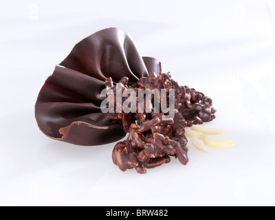 Almond slivers and chocolate fan, dark chocolate Stock Photo