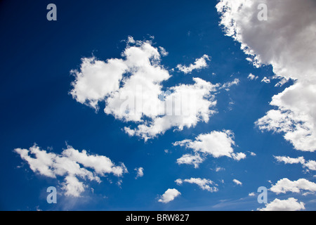 White puffy clouds on a Colorado blue sky day Stock Photo