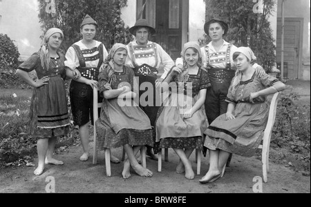 Group of women, some dressed in men's, some in women's traditional Bavarian costumes, historic photgraph, around 1930 Stock Photo