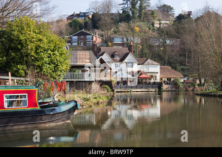 The Weyside pub beside River Wey with canal boat on the Godalming Navigation Guildford Surrey England UK. Stock Photo