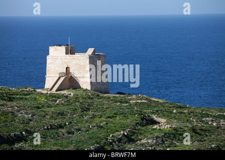 Old tower at the steep cliffs near Xlendi, Gozo, Malta, Europe Stock Photo