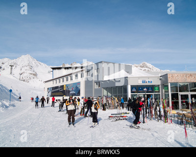 St Anton am Arlberg, Tyrol, Austria, Europe. Skiers on piste by Galzig gondola summit station and restaurant in Austrian Alps Stock Photo