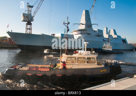 The newly launched HMS Duncan being moved for fitting out in the BAE Govan shipyard, Glasgow Stock Photo