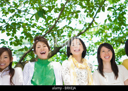 Low Angle View of Four Female Friends Stock Photo
