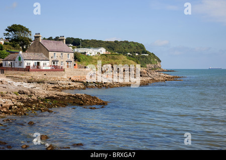 Benllech, Isle of Anglesey, North Wales, UK. Waterfront café on the rocky headland overlooking the bay Stock Photo