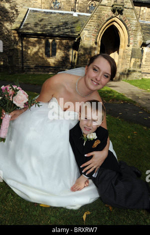 A young mother with her son on her wedding day Stock Photo