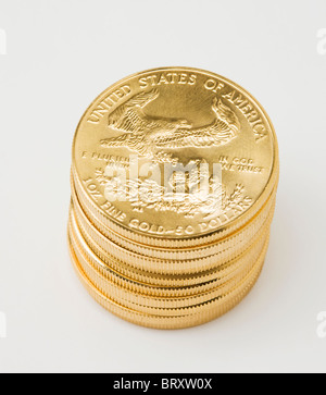 Stack of golden American coins on white background Stock Photo