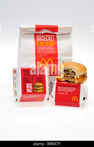 McDonald's bag with a Big Mac that has a bite out of it on white ...