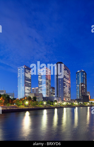 Office buildings and river at night, Osaka Prefecture, Honshu, Japan Stock Photo