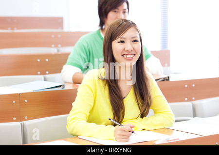 Young man and young woman studying in classroom Japan Stock Photo