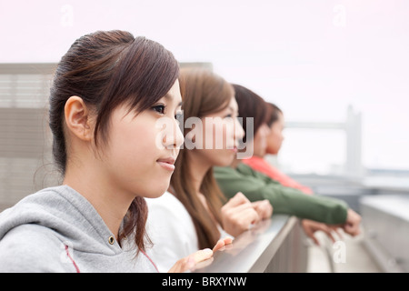 Young man and women on rooftop Japan Stock Photo