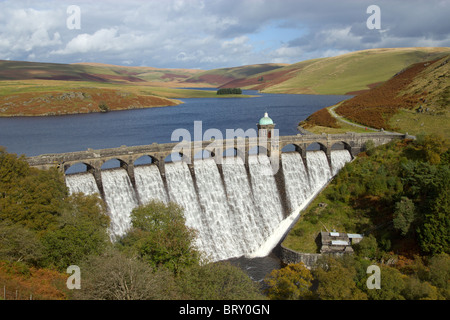 Craig Goch reservoir and dam with water overflowing, Elan Valley, Wales. Stock Photo