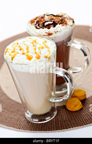 Hot beverages of coffee and chocolate with whipped cream Stock Photo