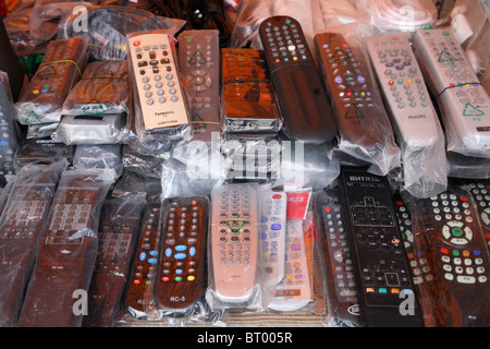Remote controls on a market stall Stock Photo