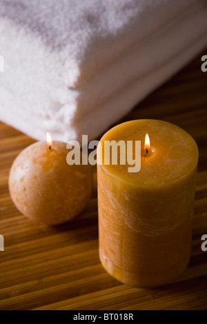 Stack of towels and candles Stock Photo