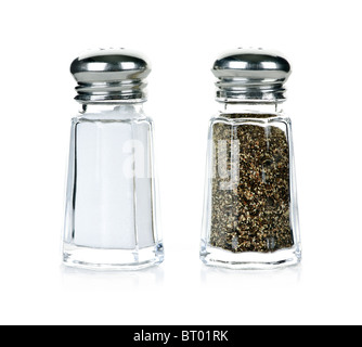 Ground salt and pepper shakers on a polished wood surface with light from a  window illuminating the table; rustic dining table with glass shakers Stock  Photo - Alamy