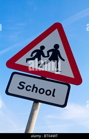 Close up view of School warning triangle sign used to warn motorists and other road traffic in the UK Stock Photo