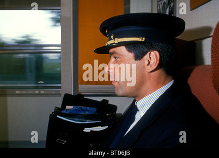 1, one, Frenchman, French man, French, man, ticket collector, controller, controleur, on train, SNCF train, train, Paris, Ile-de-France, France Stock Photo