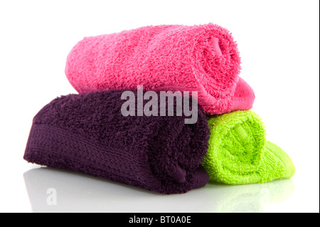 several colorful rolled towels isolated over white Stock Photo