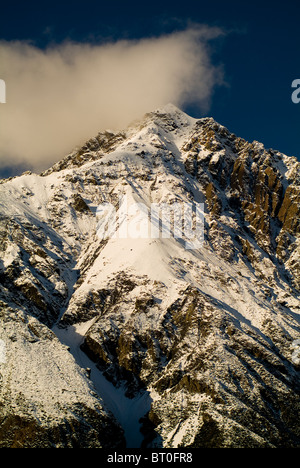 Snow capped peaks with sharp ridges and spin drift Stock Photo