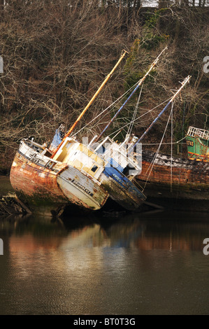 Abandoned fishing boats on the French coast Stock Photo