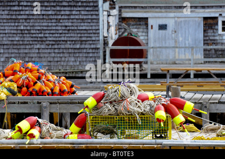 Lobster buoys and traps on a coastal wharf, Maine Stock Photo