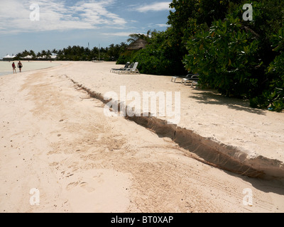 Erosion on Maldivian island, showing signs of rising sea levels Stock Photo