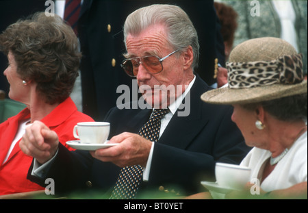 Man with carefully combed  hair  and woman having afternoon tea at the Henley Royal regatta Stock Photo