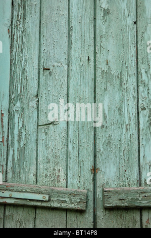 Window shutter with flaking paint. Abstract wood background. Stock Photo