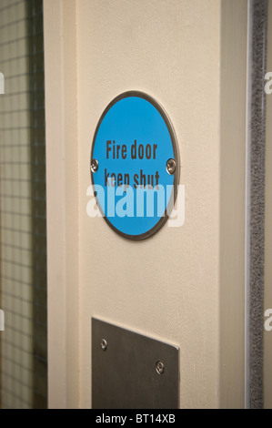 keep shut sign on a  fire door Stock Photo