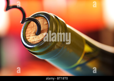 Cork screw and wine bottle Stock Photo