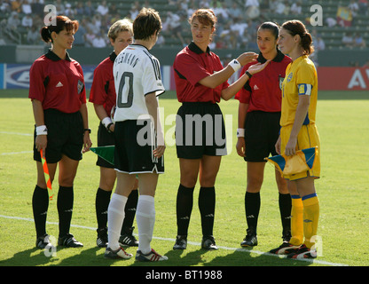 Referee Cristina Babadac discusses the coin toss with Bettina Wiegmann (l) and  Malin Mostrom (r) at the 2003 World Cup final. Stock Photo