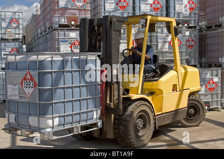 Luba Oil Freeport. Moving and loading chemical supplies in bunded area for use in offshore oil production industry Stock Photo