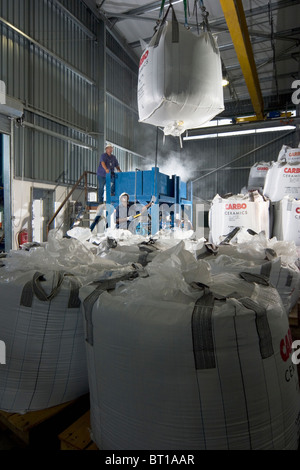 Luba Oil Freeport. Loading ceramic particles into warehouse hopper for use in offshore oil production Stock Photo