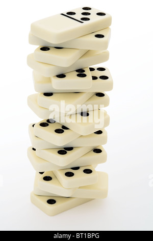 Tower from bones of a dominoes with black points Stock Photo