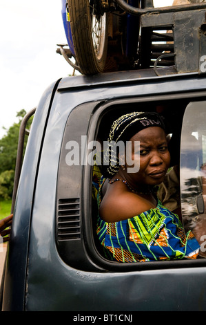 An African woman sitting inside a bush taxi in west Africa. Stock Photo