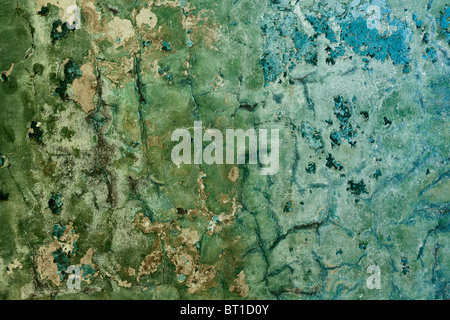 Decayed cracked concrete painted old wall background Stock Photo