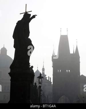 Prague - Charles bridge in the morning fog - st. John the Baptist Stock Photo