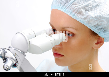 Portrait of medical student looking through microscope in laboratory Stock Photo