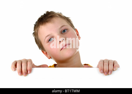Small boy looking out of a blank whiteboard isolated on white Stock Photo