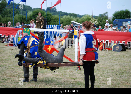 dead knight being carried off at a re-enactment event Stock Photo