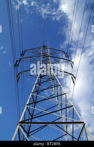 electric mast pole tower pilot on blue cloud sky cables Stock Photo