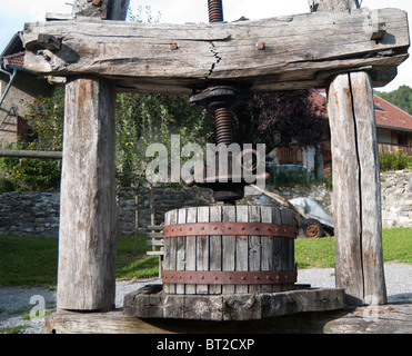 Old broken apple press used for making cider outside the Musee de la Pomme in Seraval Haute Savoie France Stock Photo