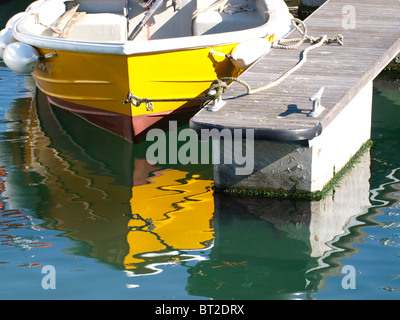 Reflections of boat in harbour, Padstow, UK Stock Photo