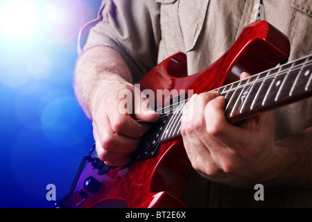 Guitar player on stage Stock Photo